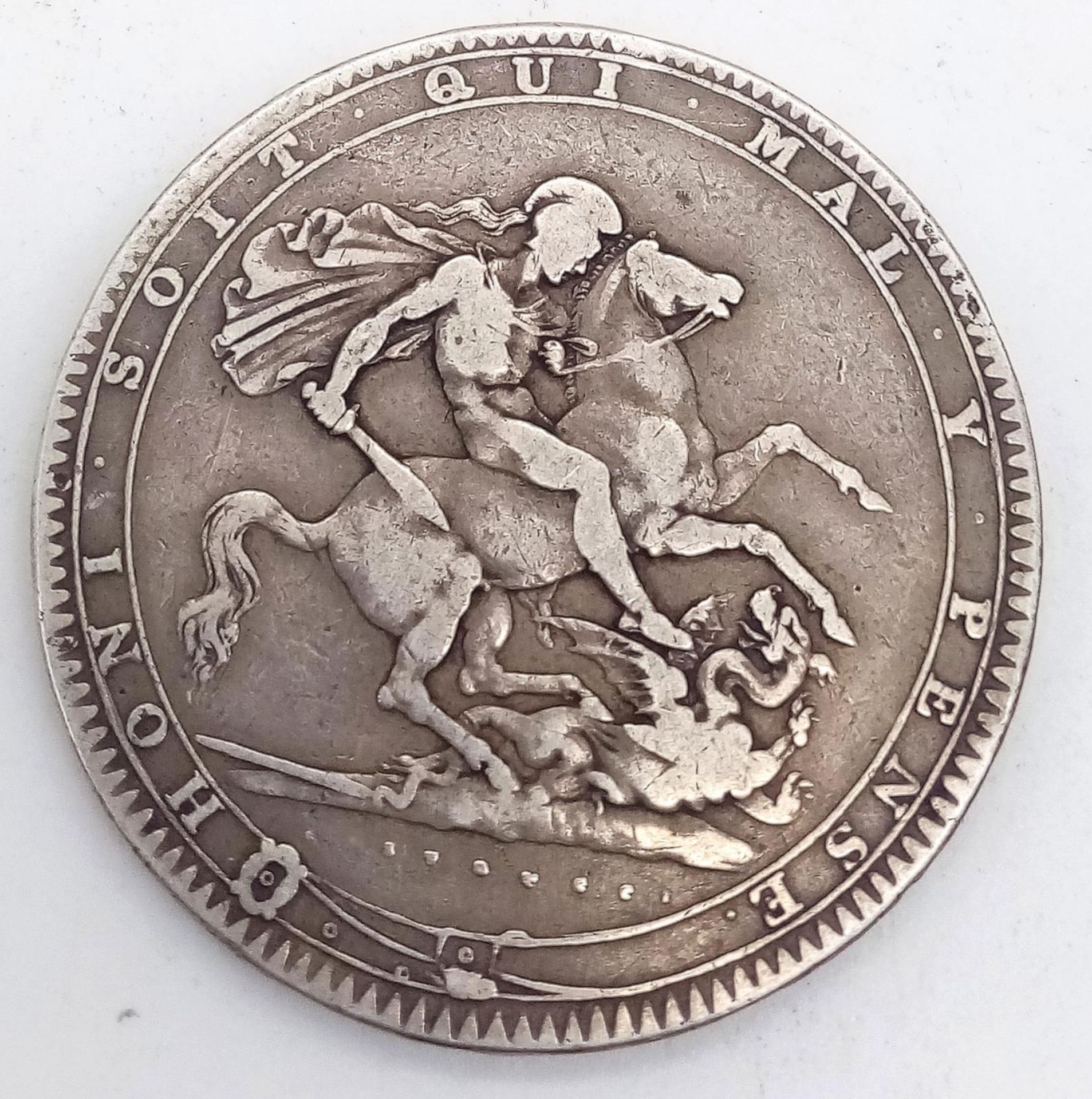 A GEORGE III SILVER CROWN 1820 WITH GEORGE SLAYING THE DRAGON ON THE REVERSE SIDE . - Image 2 of 3
