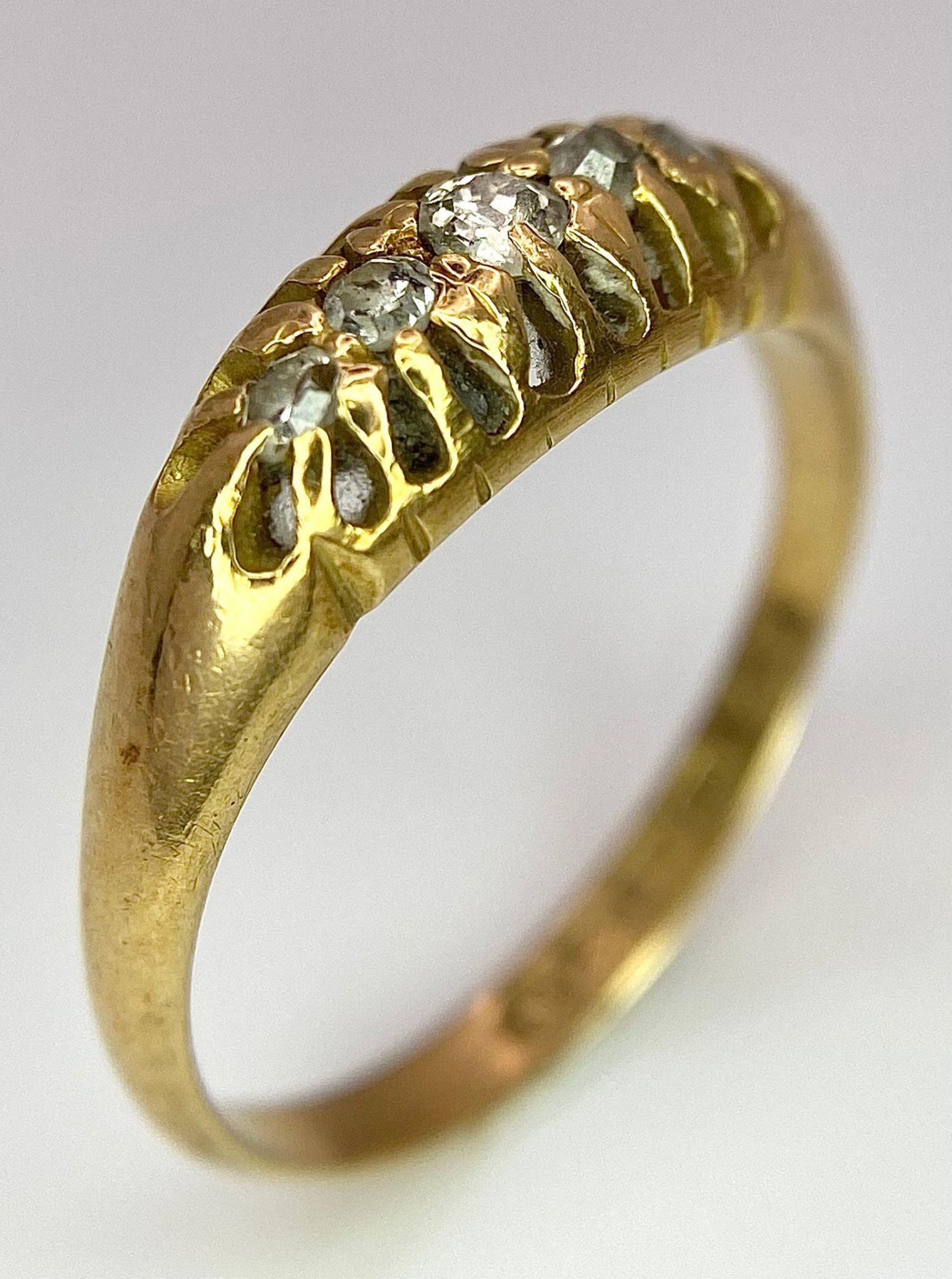 An 18 K yellow gold ring with a band of five diamonds, size: O, weight: 3.2 g. - Image 4 of 7