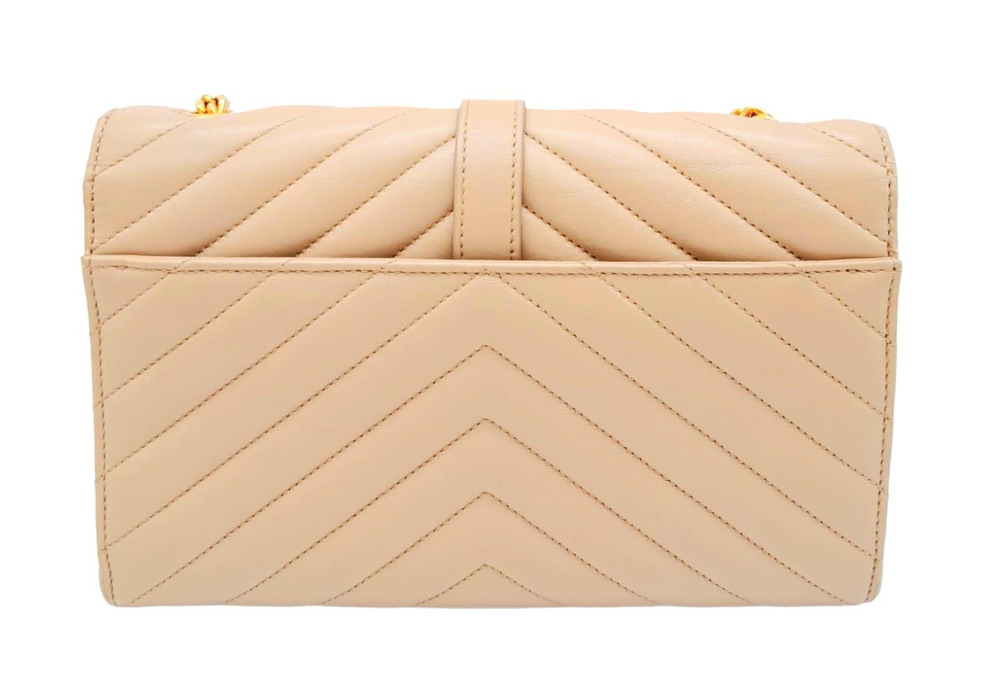 A Saint Laurent envelope shoulder bag, soft beige calfskin with gold hardware and strap, press - Image 4 of 11