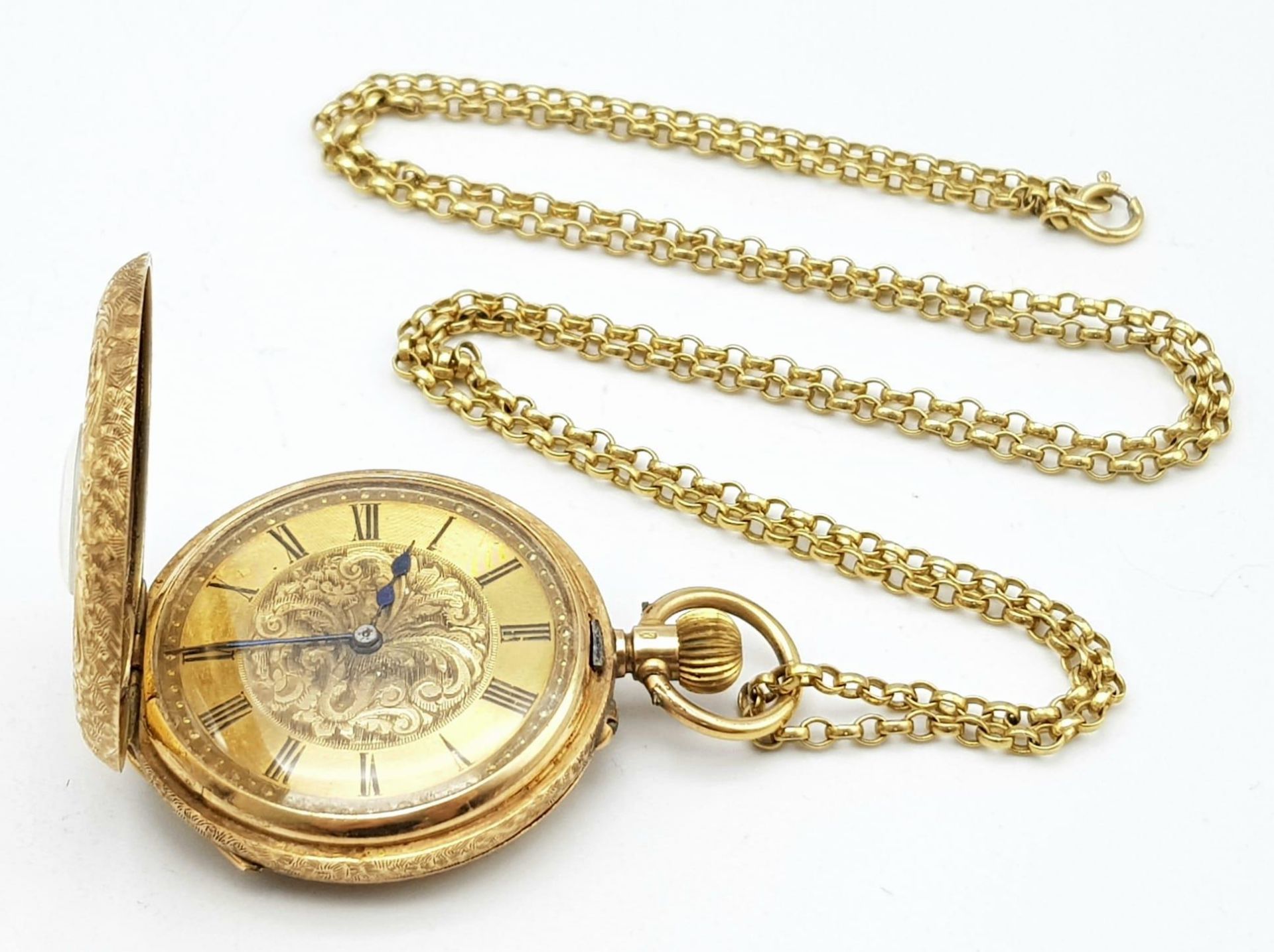 A beautiful 14 K yellow gold half hunter/pendant watch, heavily engraved on a long (64 cm) 9 k