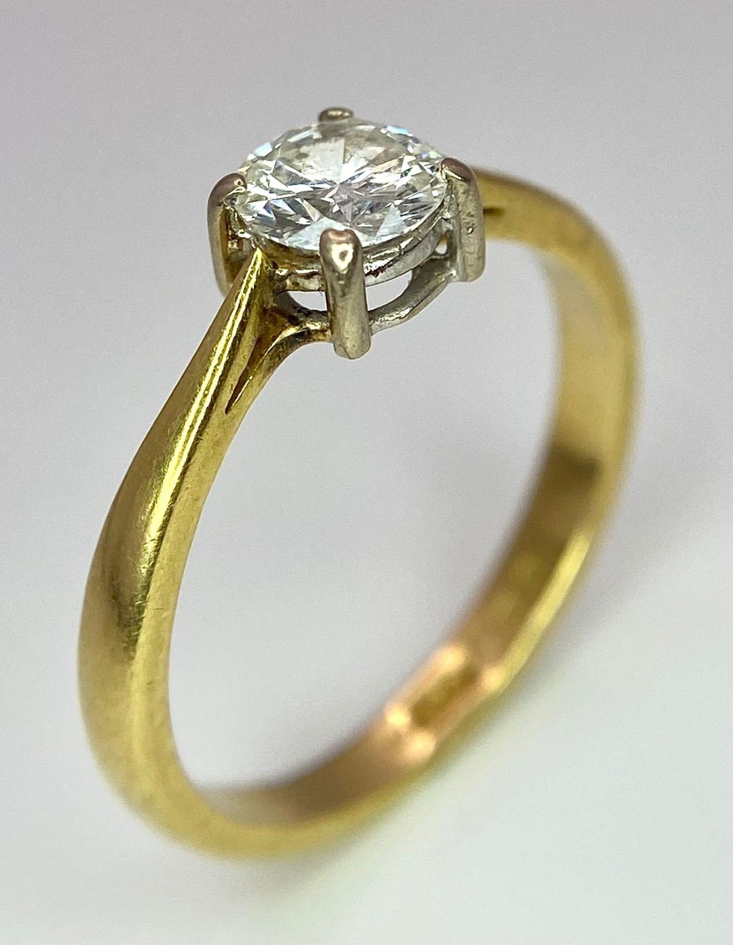 An 18K Yellow Gold Diamond Solitaire Ring. Brilliant round cut - 0.45ctw. 2.5g total weight. Size L. - Image 2 of 7