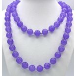 A Matinee Length Lavender Jade Beaded Necklace. 12mm beads. 88cm necklace length.