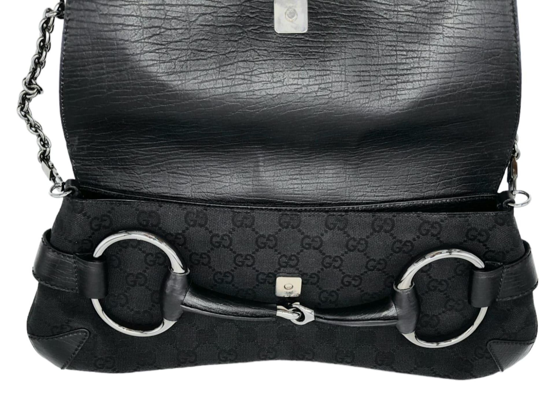 A Gucci GG black canvas bag featuring the black and gunmetal grey horsebit and metal shoulder strap. - Image 4 of 6