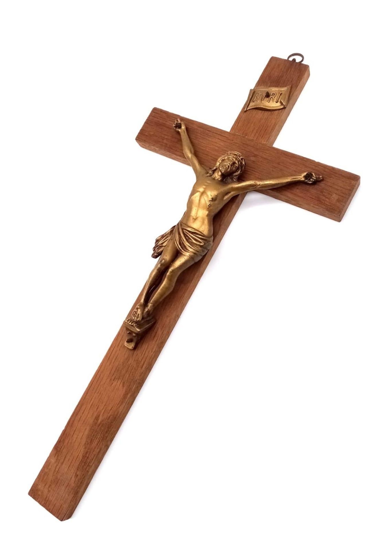 A Wood and Gilded Metal Wall-Hanging Crucifix. 35cm x 18cm.
