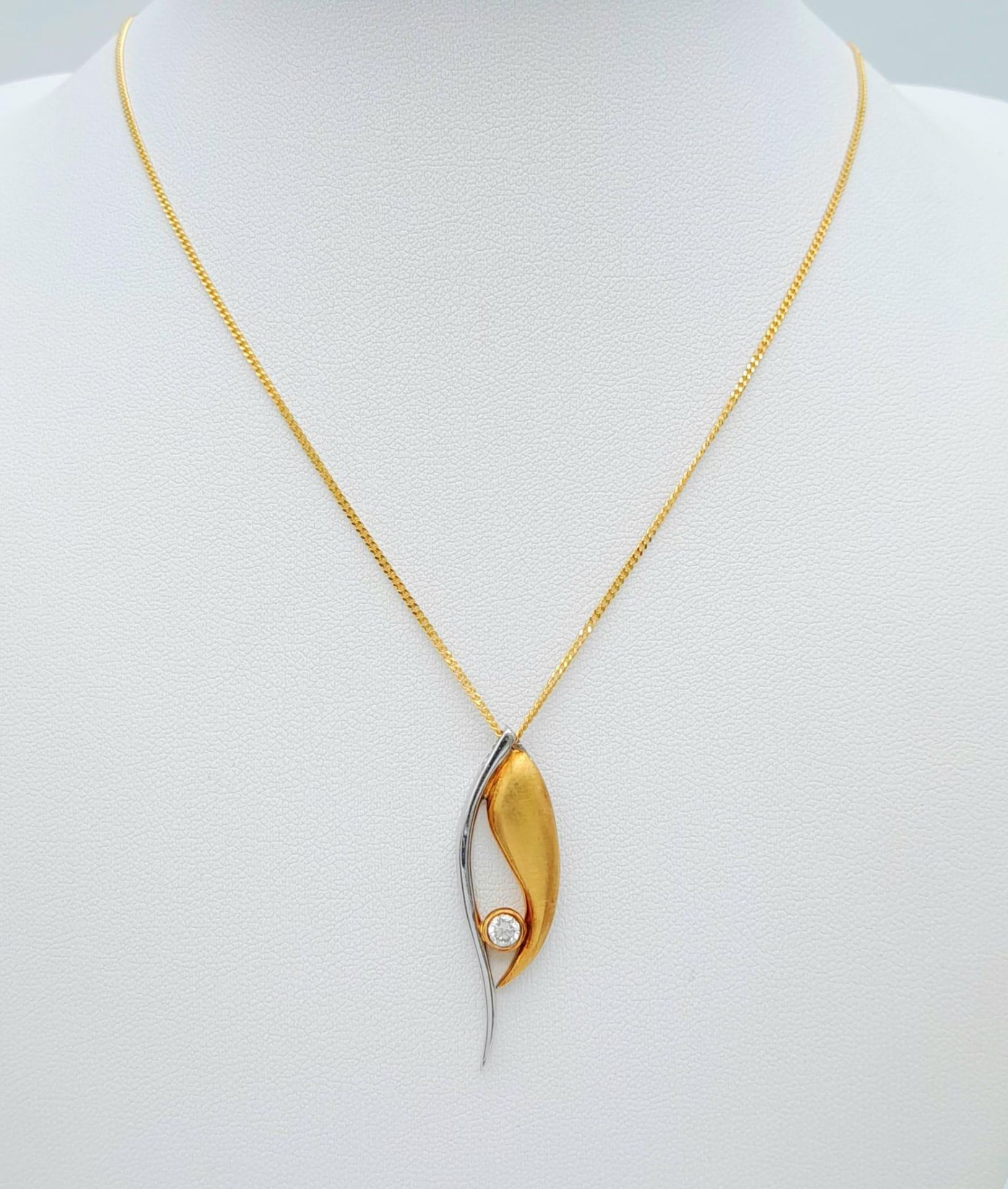 An 18K Bi Colour Gold Diamond Pendant on an 18K Yellow Gold Disappearing Necklace. 0.15ct diamond.