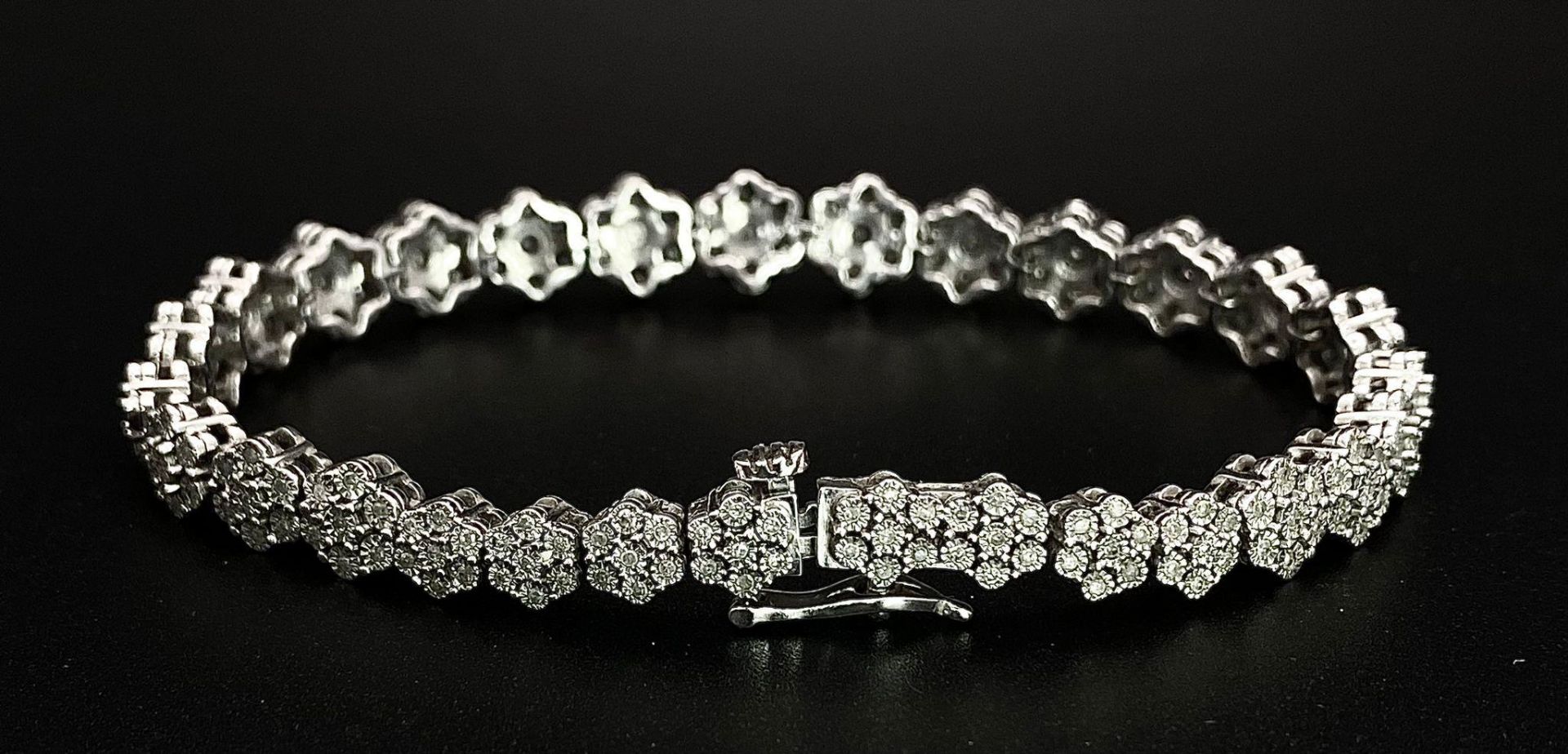 A 9K White Gold Graduated Link Diamond Tennis Bracelet. 29 links of seven small diamonds - 203 - Image 3 of 9
