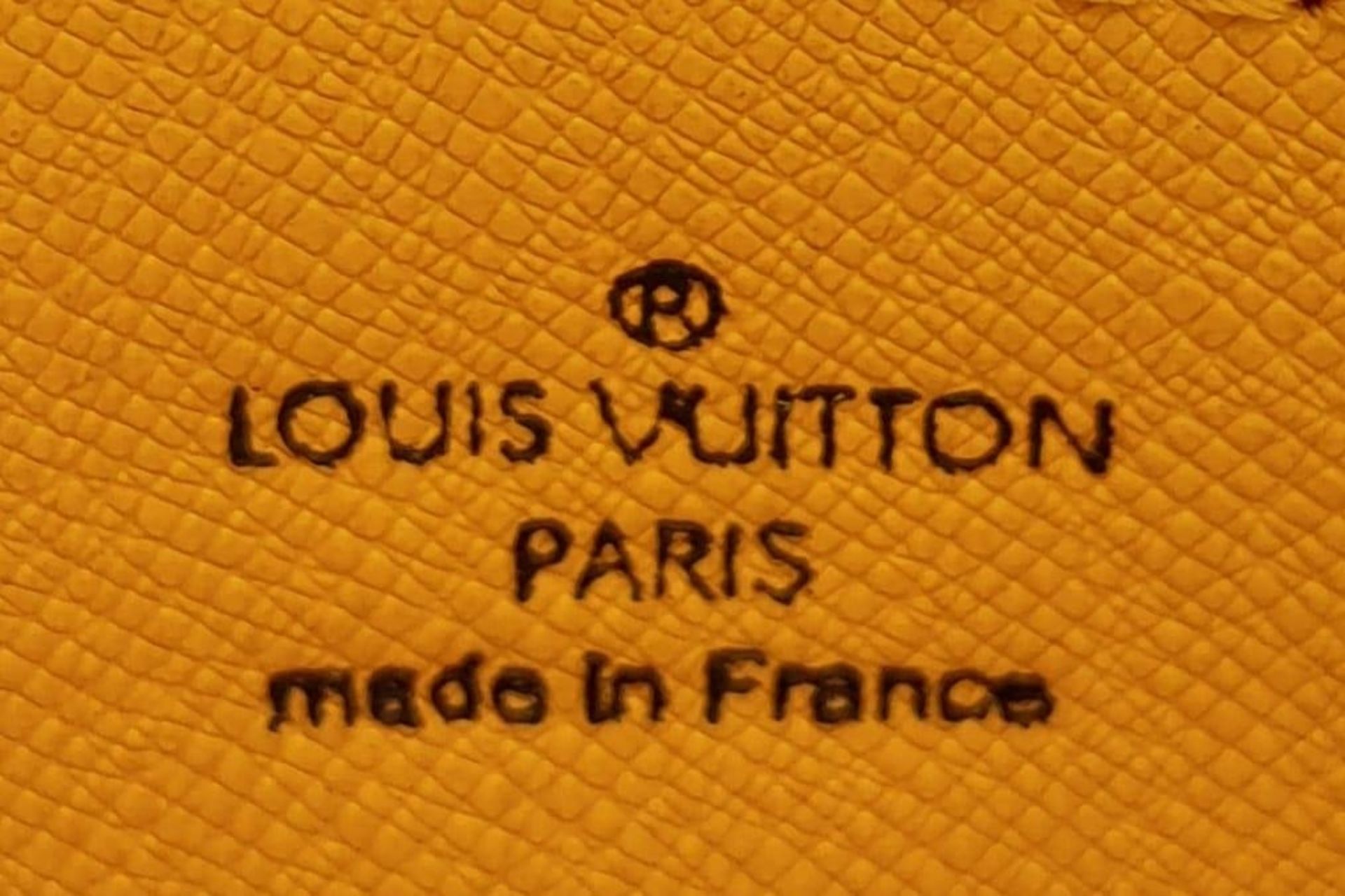 A Louis Vuitton Vanilla Wallet. Epi leather exterior gold-toned hardware and zipped top closure. - Image 7 of 9