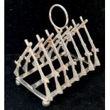 A Silver Plated ‘Rifle Rack’ Toast Rack as used in Military Clubs and Regimental Mess’. 11cm Wide.