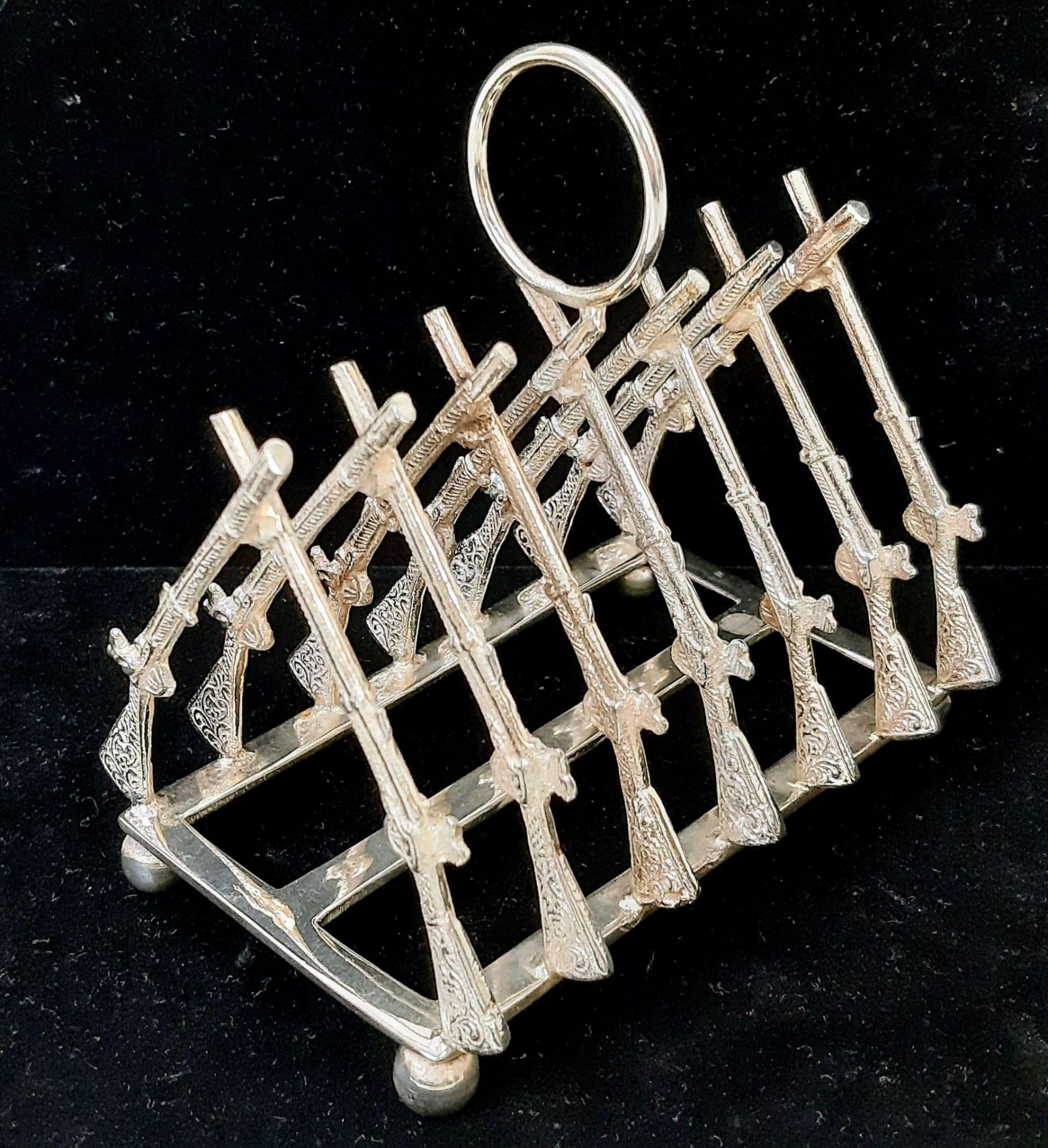 A Silver Plated ‘Rifle Rack’ Toast Rack as used in Military Clubs and Regimental Mess’. 11cm Wide.