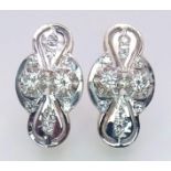 An 18 K white and yellow gold pair of earrings with a nice, diamond set design, length: 21 mm,