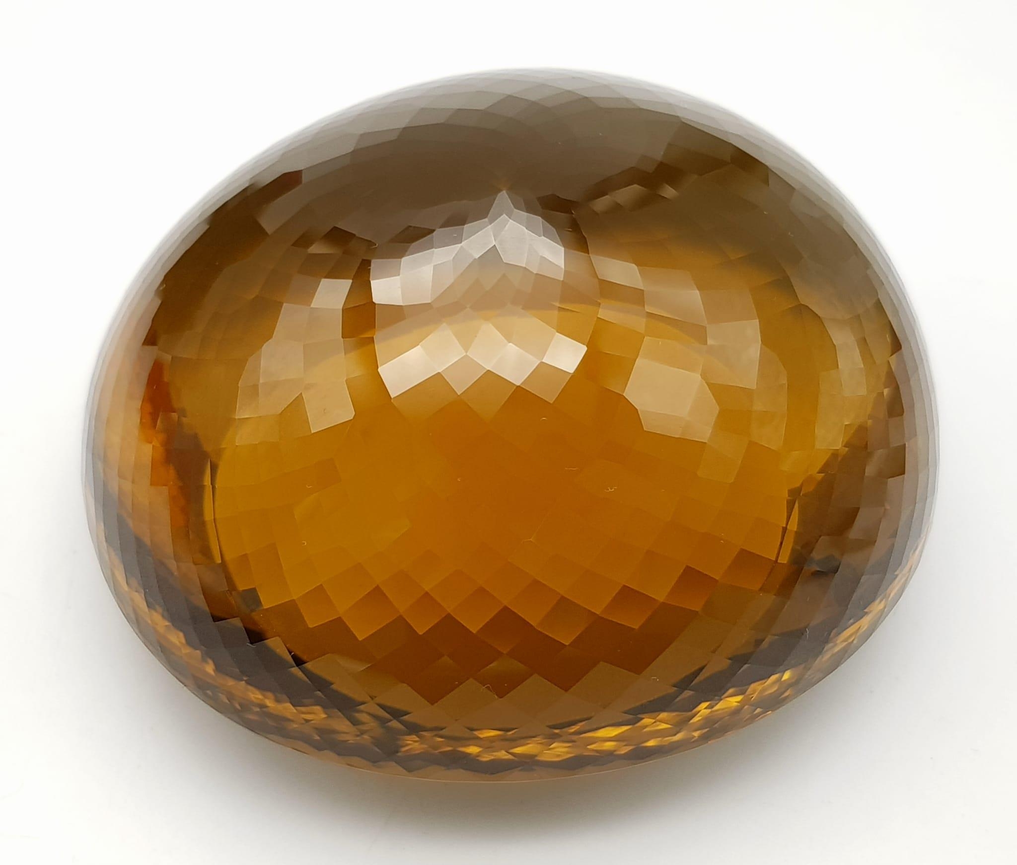 An Immense 3632ct Citrine Quartz Gemstone. Oval cut and beautifully faceted. 10 x 9cm. Comes with - Image 8 of 13