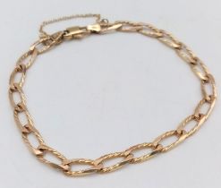 A 9K yellow gold chain bracelet, lobster clasp with security chain. 22cm length, 8.3g weight.