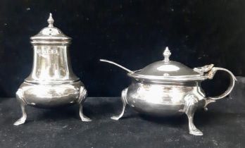 A vintage sterling silver condiment set include a salt cellar and shaker with full London hallmarks,