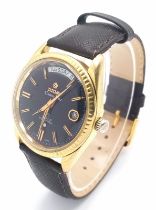 A Vintage Titoni Cosmo King Gents Watch. Brown leather strap. Gilded case - 38mm. Black dial with