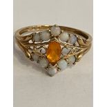 9 carat YELLOW GOLD RING,set with OPAL and Orange Baguette. Having attractive GOLD filigree detail