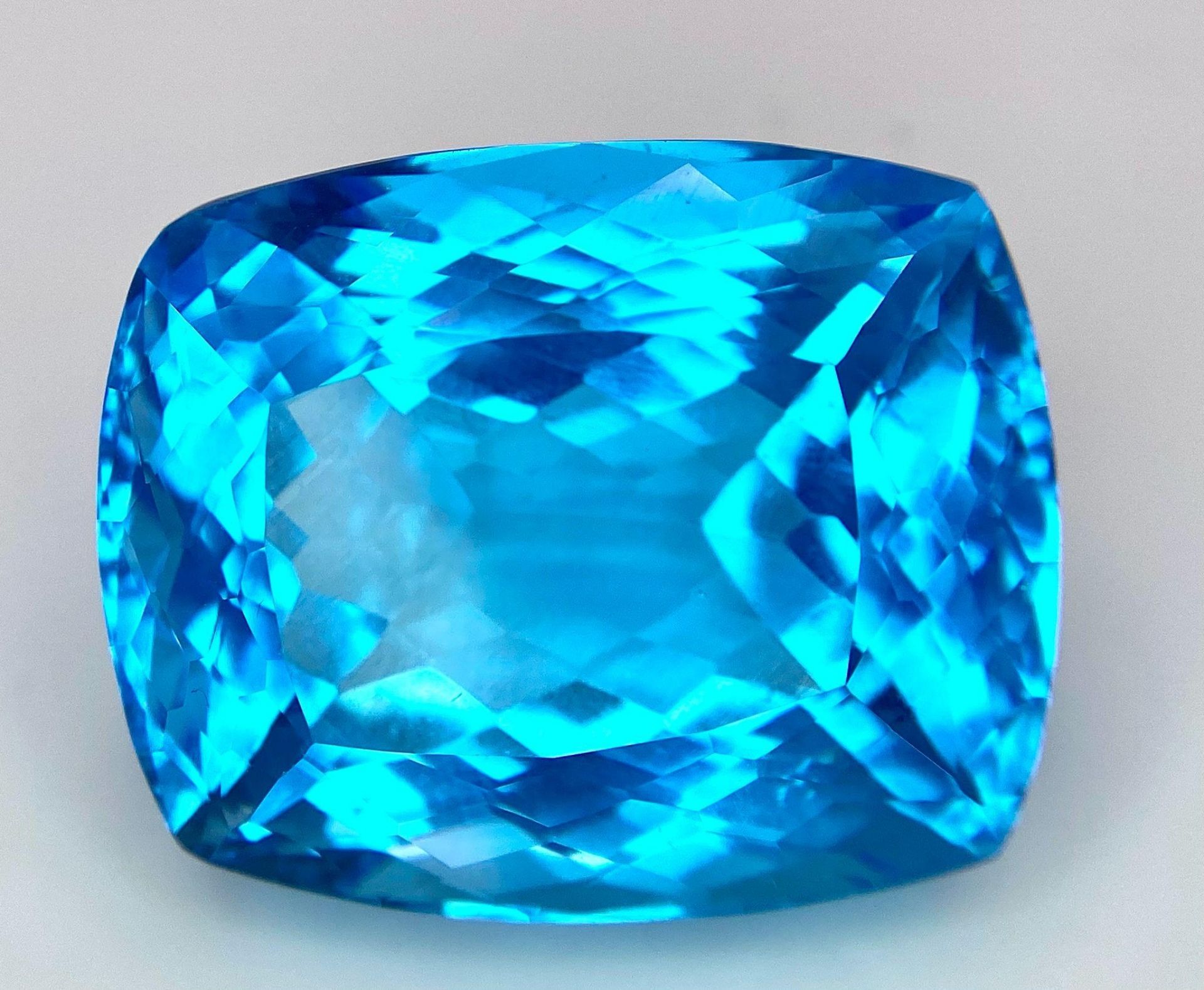 A Huge 142ct London Blue Topaz Natural Gemstone. Rectangular cushion cut. 33mm x 28mm. No visible