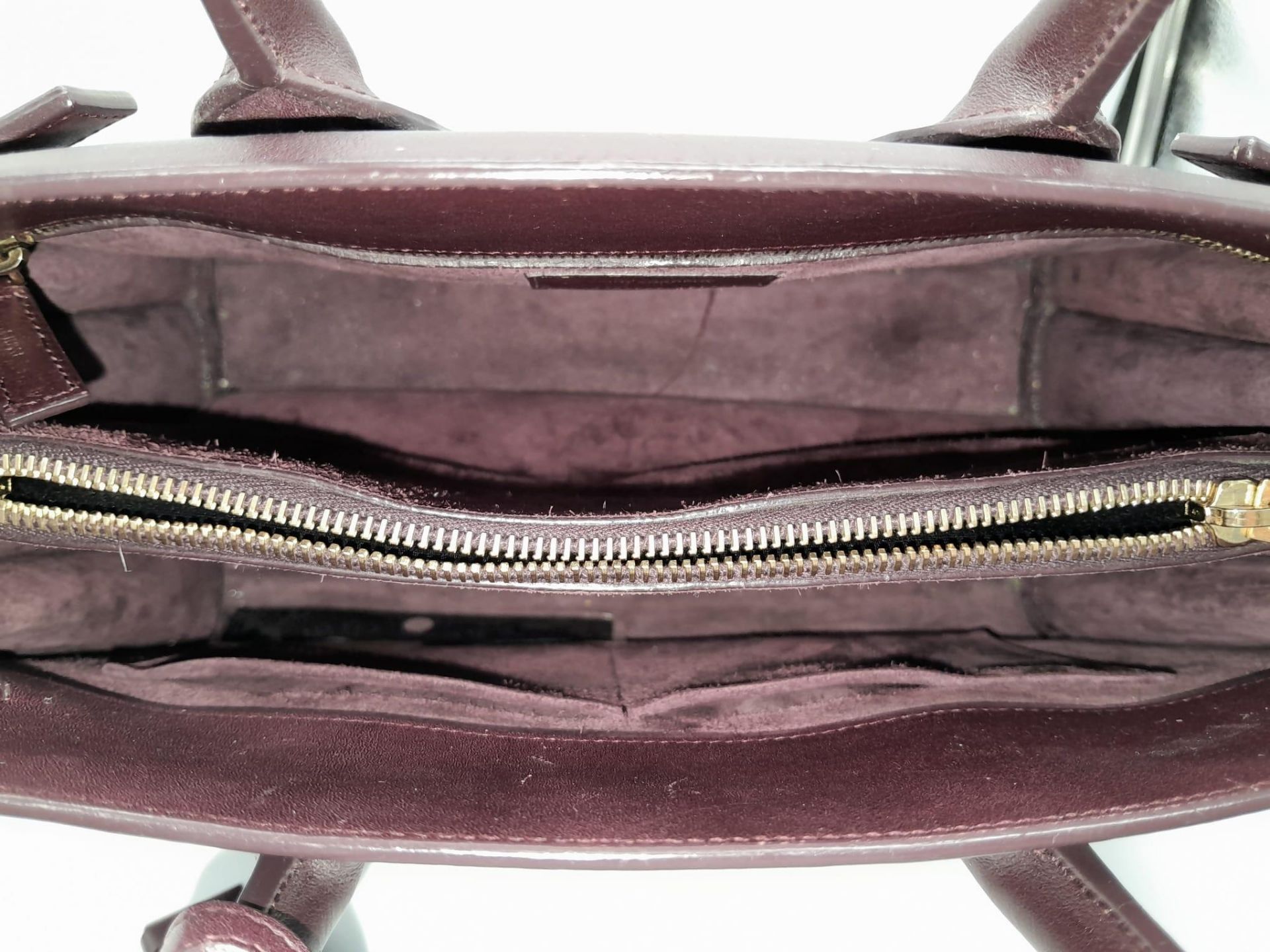A Saint Laurent Sac De Jour Burgundy Handbag. Leather Exterior, Gold Tone Hardware, Double Handle in - Image 6 of 11