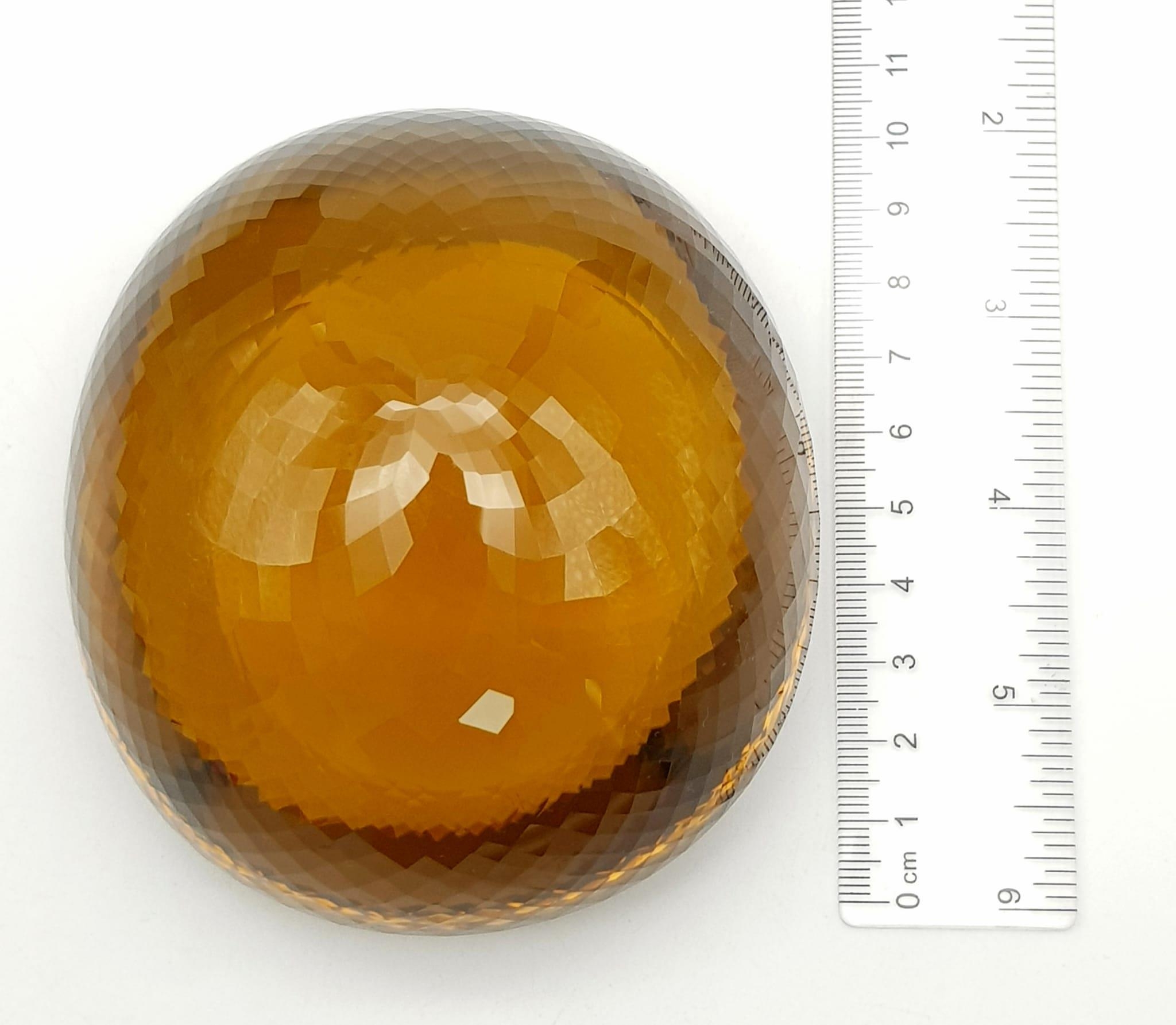 An Immense 3632ct Citrine Quartz Gemstone. Oval cut and beautifully faceted. 10 x 9cm. Comes with - Image 9 of 13