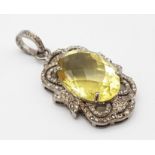 An Oval Faceted Lemon Quartz and Diamond Art Deco Style Pendant set in 925 Silver. 4cm. Weight - 7.