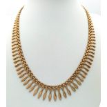 A FABULOUS DESIGNER GRADUATED CHOKER NECKLACE IN 9K GOLD WITH SAFETY CATCH . 18 8gms