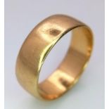 An 18K Yellow Gold (tested) Band Ring. 6mm width. Size L. 4.3g weight.