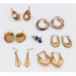 An eclectic selection of seven pairs of 9 K yellow gold earrings with a total weight of 13.8 g.