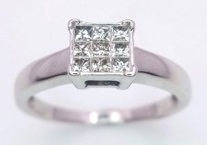 An 18K White Gold (tested) Diamond Ring. 0.30ct. Size M. 3g total weight.