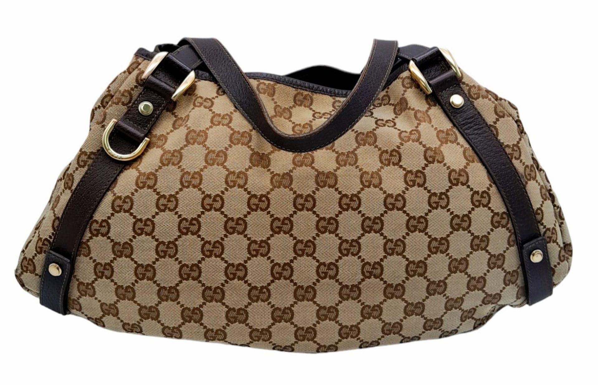 A Gucci Brown Monogram 'Abbey' Shoulder Bag. Canvas exterior with leather trim, gold-toned hardware, - Image 2 of 8