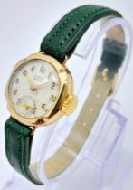A Vintage Omer 9K Gold Cased Ladies Watch. New green leather strap. 9K gold case - 21mm. White