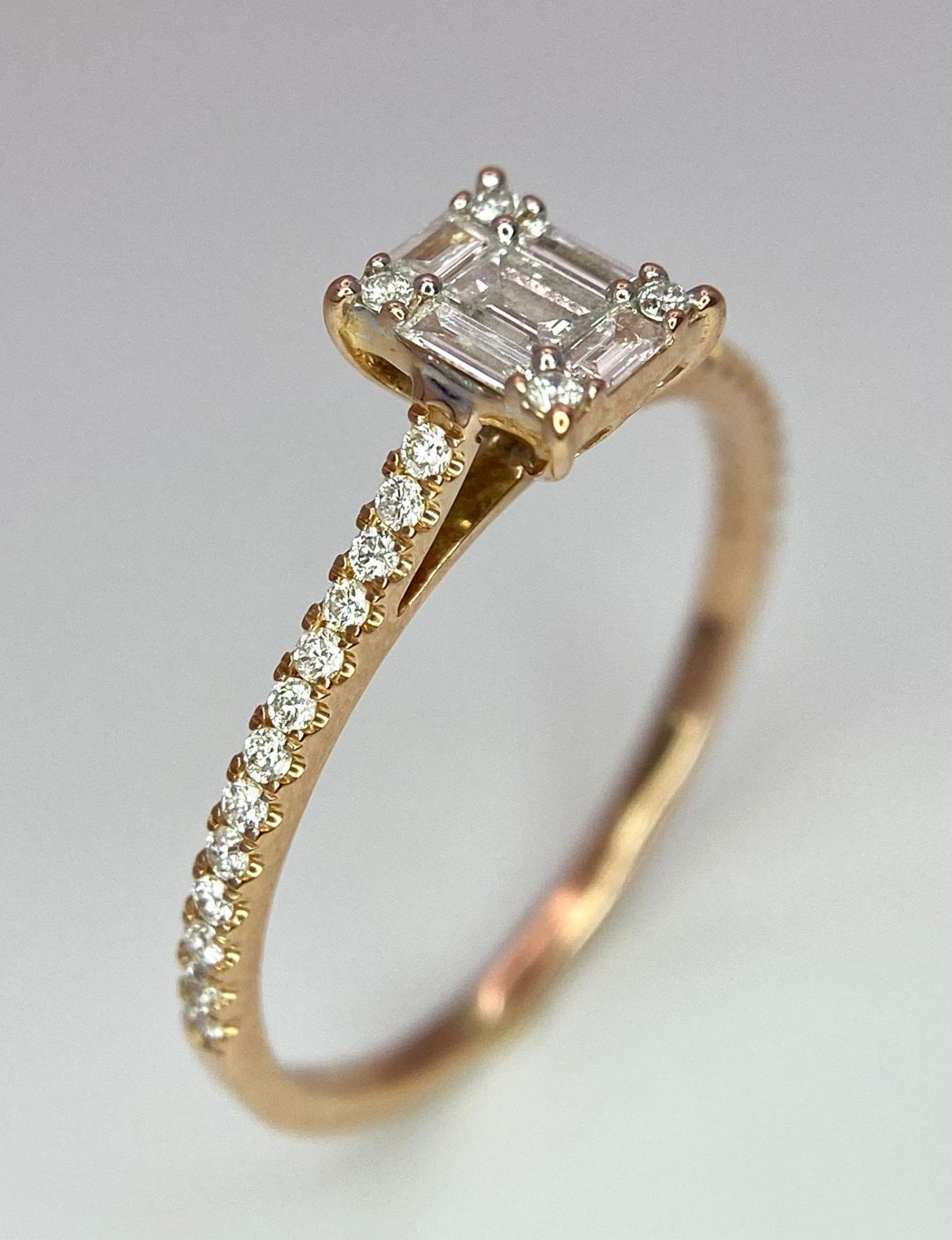An 18 K rose gold ring with a square emerald cut diamond and more round cut diamonds on the - Image 5 of 8