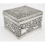 A SOLID SILVER HINGED TRINKET BOX HAND ENGRAVED WITH AN AFRICAN THEME, IN VERY GOOD CONDITION AND