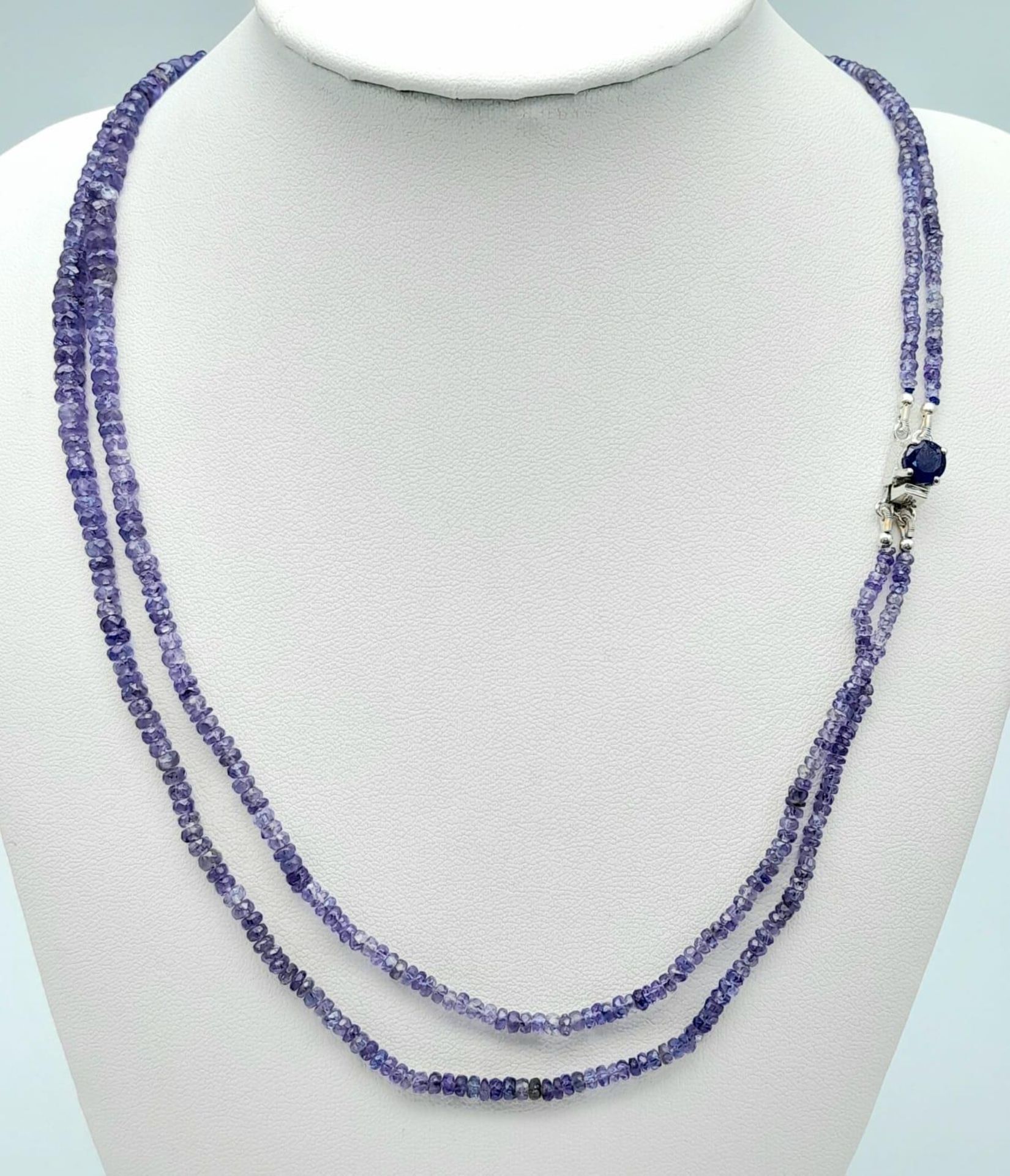A 100ctw Two Row Tanzanite Necklace with a Sapphire and 925 Silver Clasp. 48cm length, 20.3g total