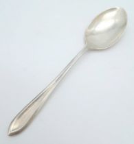 A vintage sterling silver tea spoon. Full hallmarks Sheffield, 1947. Total weight 27.7G. Total