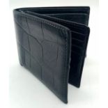 A black leather Mulberry wallet, can hold up to 8 cards, includes a coin pouch. Size approx. 11x9cm.