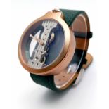 A Verticale Mechanical Top Winder Gents Watch. Green leather strap. Gold tone ceramic gilded