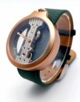 A Verticale Mechanical Top Winder Gents Watch. Green leather strap. Gold tone ceramic gilded