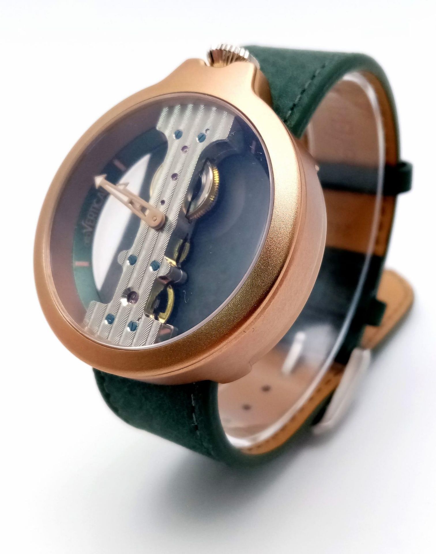 A Verticale Mechanical Top Winder Gents Watch. Green leather strap. Gold tone ceramic gilded