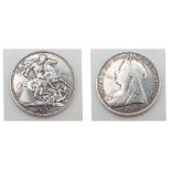 An 1897 Queen Victoria Silver Crown Coin. VF+ grade but please see photos.