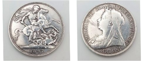 An 1897 Queen Victoria Silver Crown Coin. VF+ grade but please see photos.