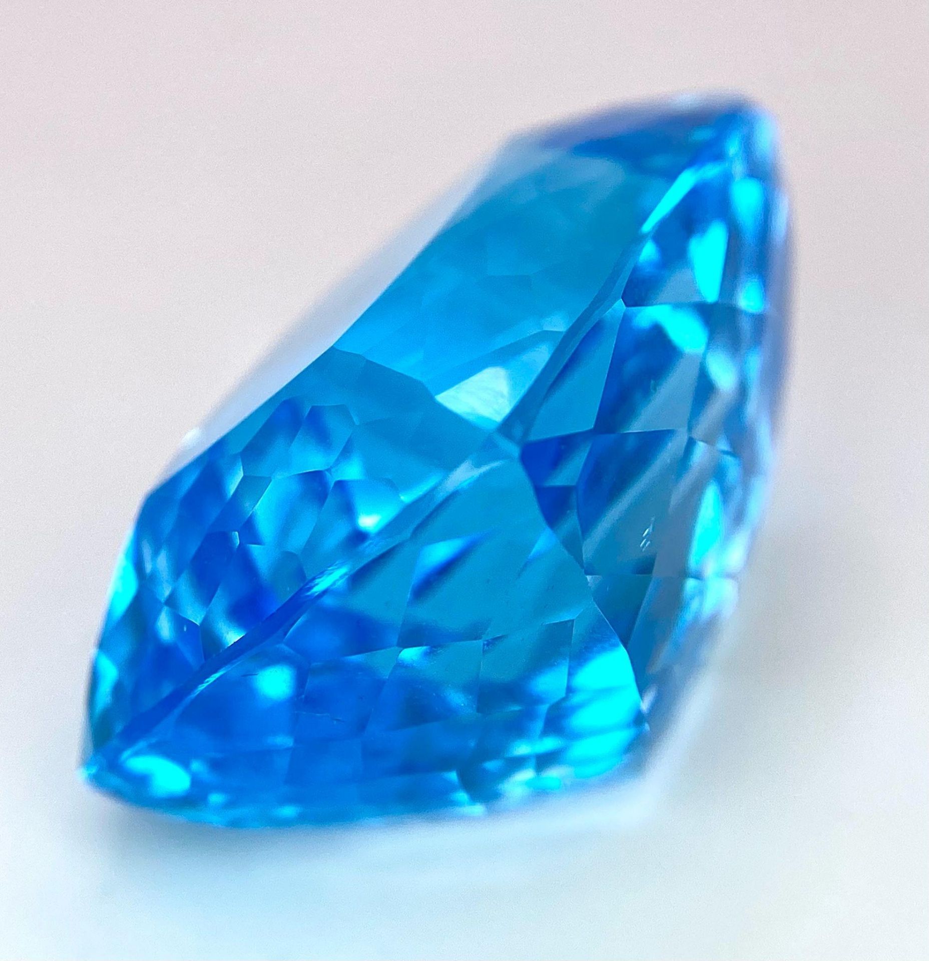 A Huge 142ct London Blue Topaz Natural Gemstone. Rectangular cushion cut. 33mm x 28mm. No visible - Image 2 of 7