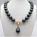 A Metallic Dark Grey South Sea Pearl Shell Necklace with a Teardrop Pendant. 14mm large beads.