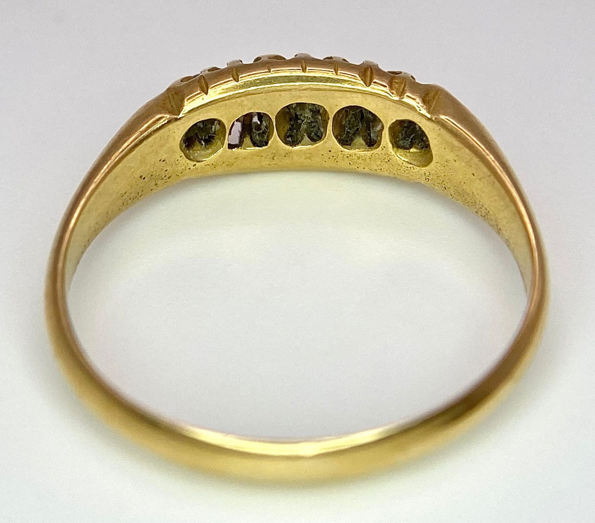 An 18 K yellow gold ring with a band of five diamonds, size: O, weight: 3.2 g. - Image 6 of 7