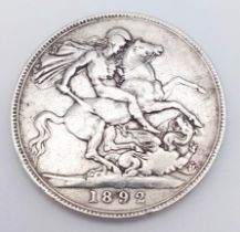 An 1892 Queen Victoria Silver Crown Coin. VF grade but please see photos.