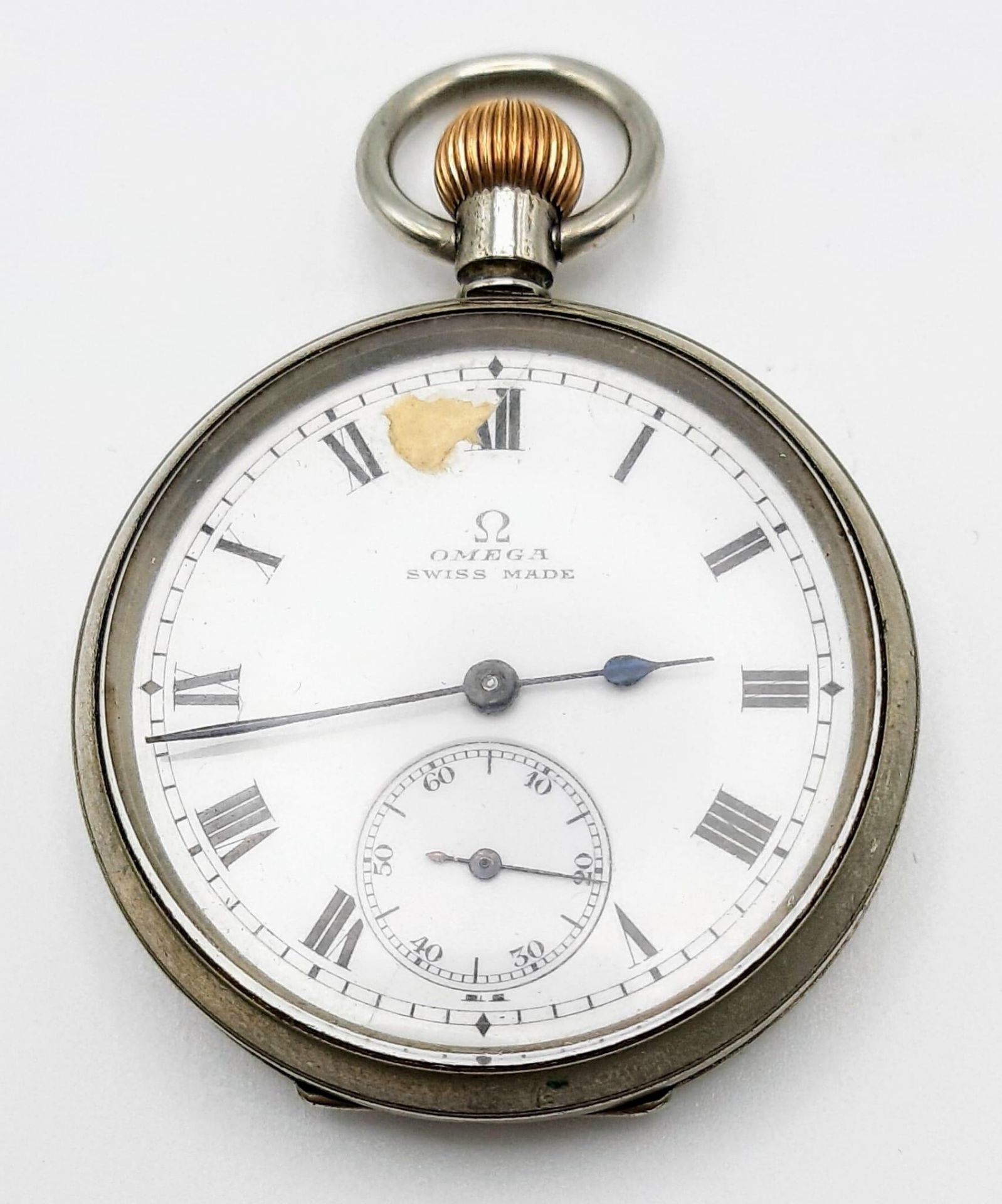 An Antique (WWI Era) Omega White Metal Pocket Watch. 5128166 movement. White dial with second sub