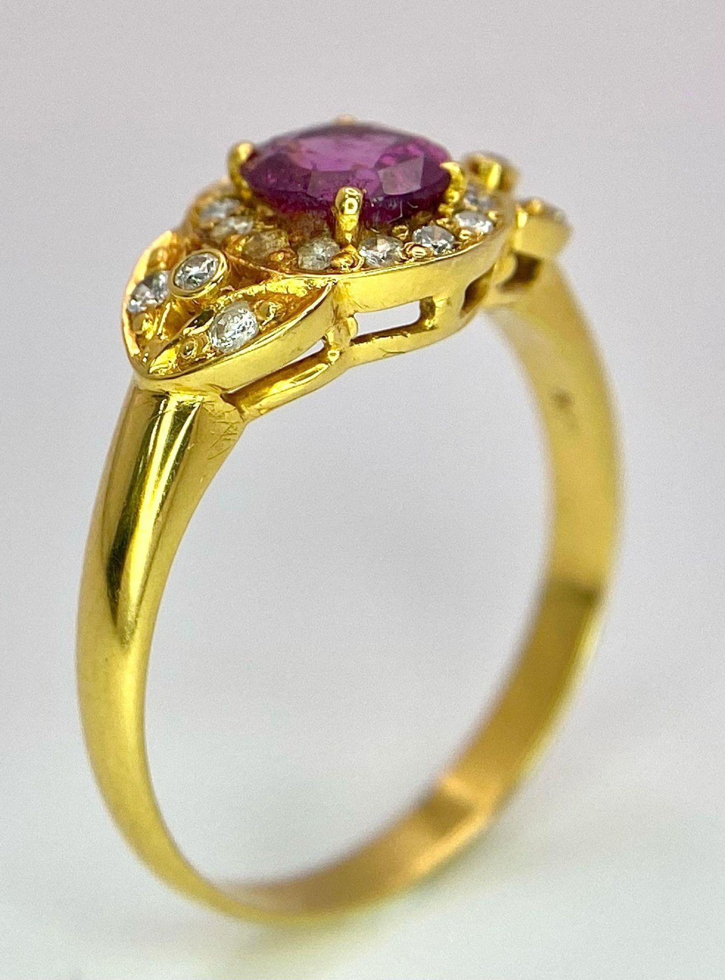 An 18K Yellow Gold Pink Sapphire and Diamond Ring. Central oval sapphire with diamond halo and - Image 6 of 12