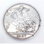 A QUEEN VICTORIA SILVER CROWN DATED 1887 IN GOOD CONDITION .