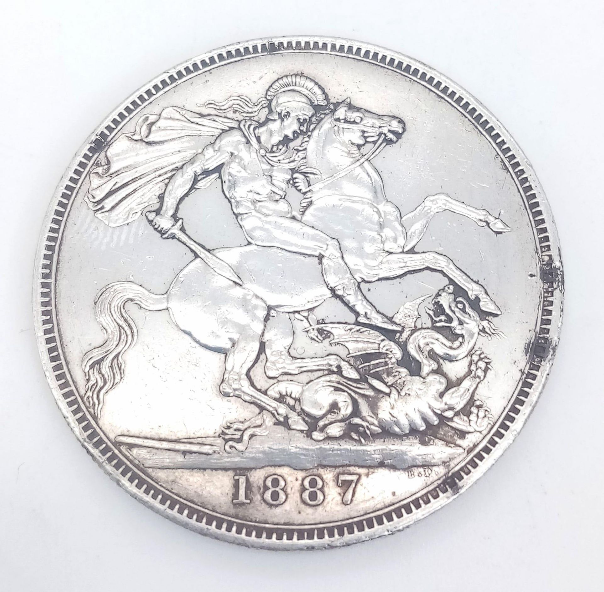 A QUEEN VICTORIA SILVER CROWN DATED 1887 IN GOOD CONDITION .