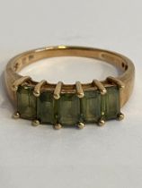 9 carat YELLOW GOLD and EMERALD RING. Consisting 5 x traditional cut Emerald gemstones mounted to