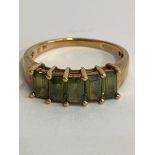 9 carat YELLOW GOLD and EMERALD RING. Consisting 5 x traditional cut Emerald gemstones mounted to