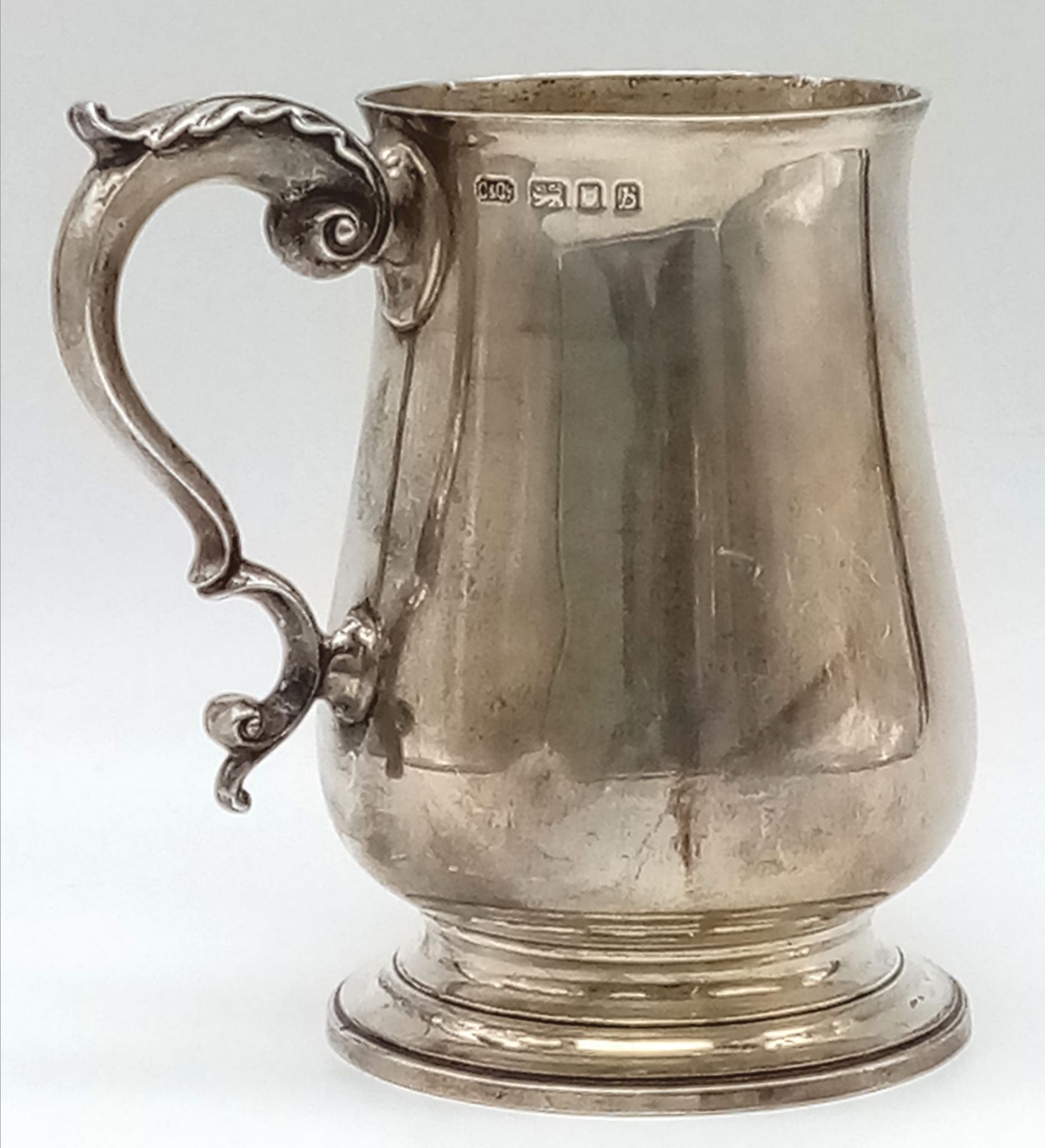 A Vintage Sterling Silver Tankard. Classic design with an ornate handle. 14cm tall. Hallmarks for